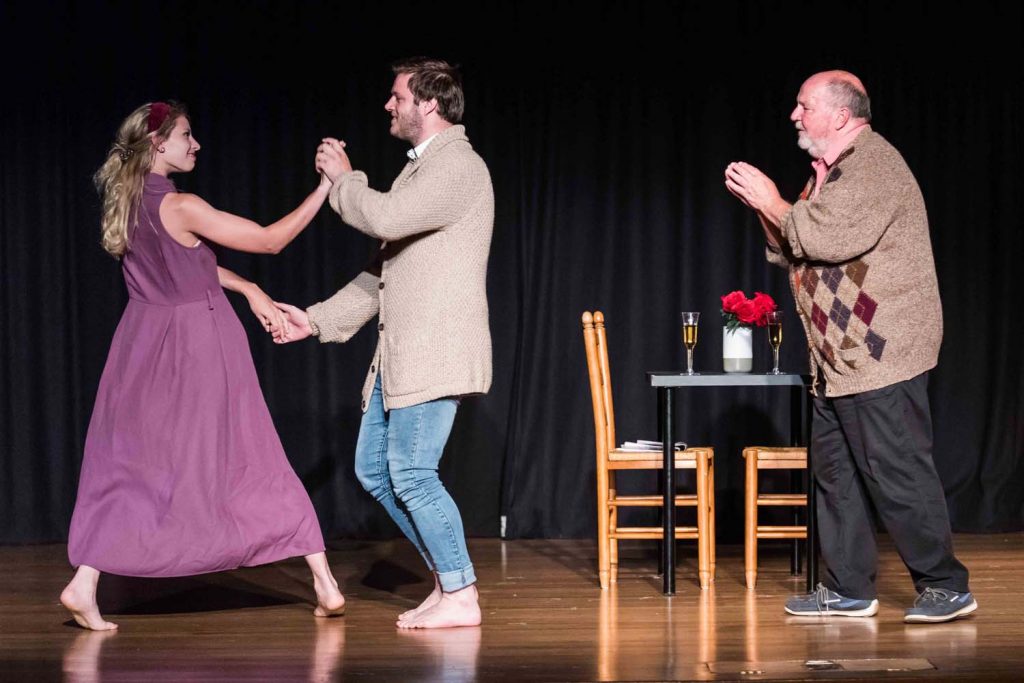 Production Still. Les Asmussen as Old Tom, Jayden Muir as Heather, Abbie Gallagher as Karen, and Murray John Curtis as Young Tom in The Short+Sweet Sydney Production of Valentine's Day By James Hutchison. Directed by Sarah Purdue. Photograph by  Chris Lundie