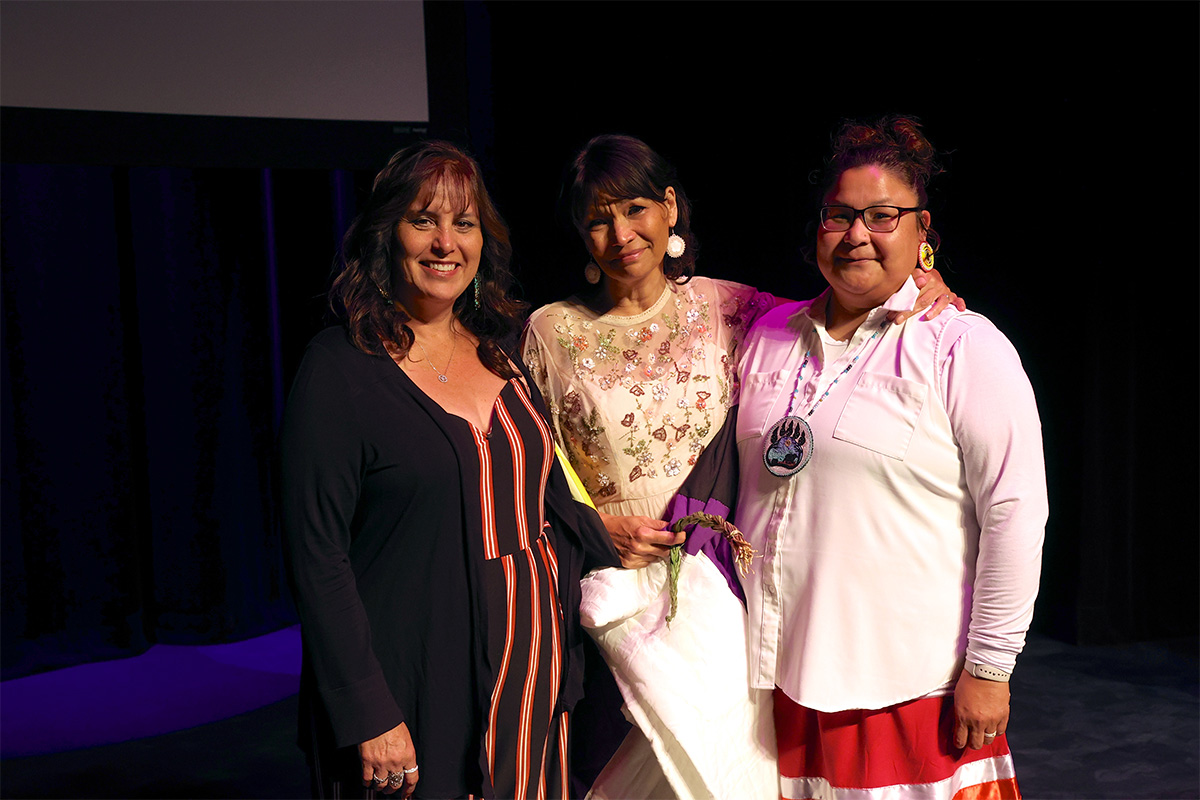 L to R: Lori Davis, Michelle Thrush, Chief Rossa Wahobin, Nakaneet First Nation, Chief Rossa Wahobin presented Michelle with a Star Quilt in recognition of her achievements, Photo credit Randy Feere