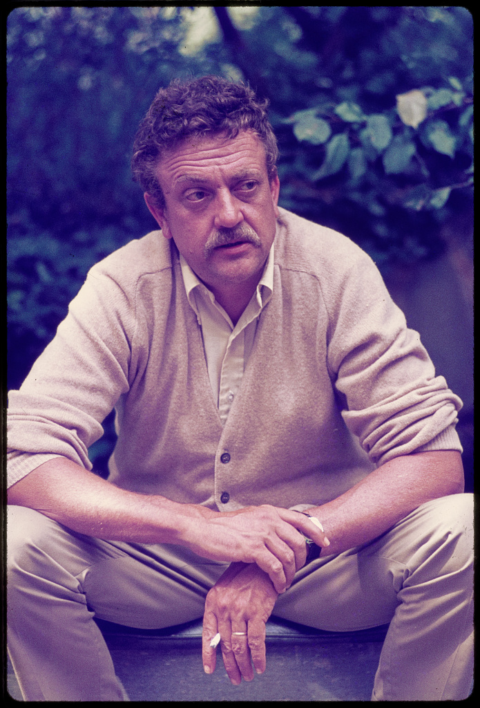 PHOTO of Kurt Vonnegut sitting in the backyard – slide – from the library of congress. Credit line: Library of Congress, Prints & Photographs Division, photograph by Bernard Gotfryd, [Reproduction number e.g., LC-USZ62-123456]