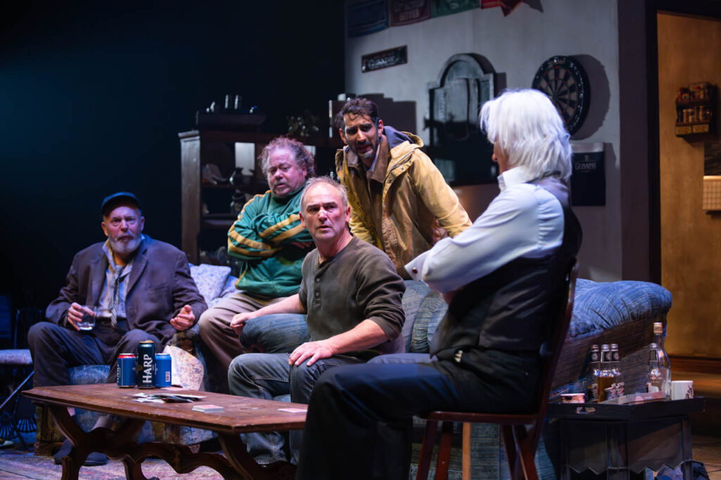 Christopher Hunt, David Trimble, Shaun Smyth (seated), Chirag Naik and Paul Gross in Alberta Theatre Projects’ production of The Seafarer. Photo by Benjamin Laird. Set & Props Design by Hanne Loosen. Costume Design by Ralamy Kneeshaw. Lighting Design by Anton deGroot.