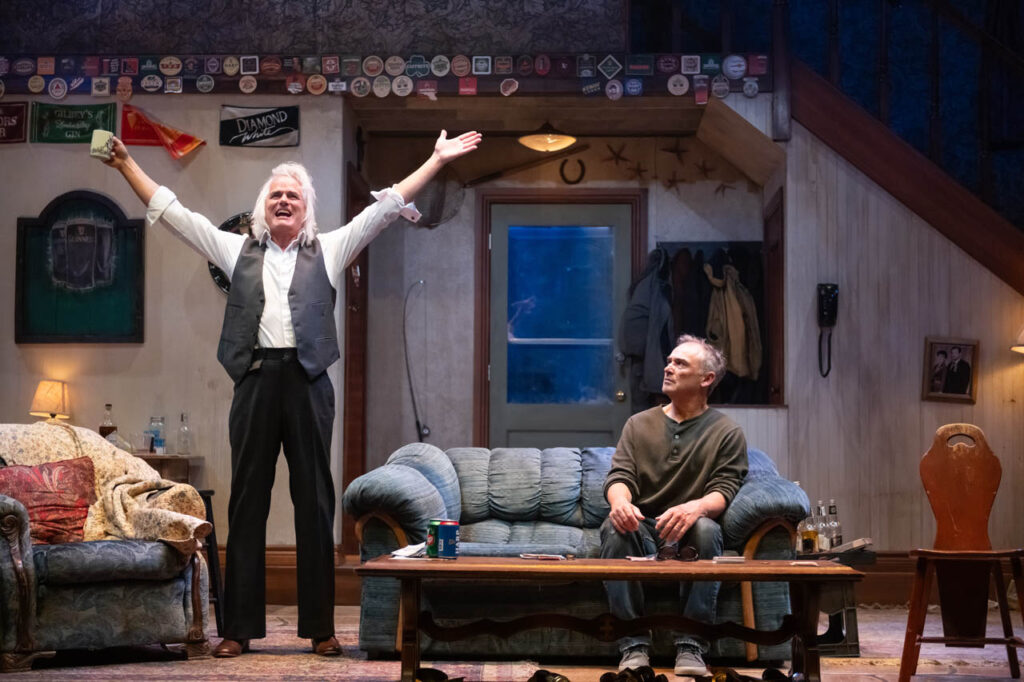 Paul Gross and Shaun Smyth in Alberta Theatre Projects’ production of The Seafarer. Photo by Benjamin Laird. Set & Props Design by Hanne Loosen. Costume Design by Ralamy Kneeshaw. Lighting Design by Anton deGroot.